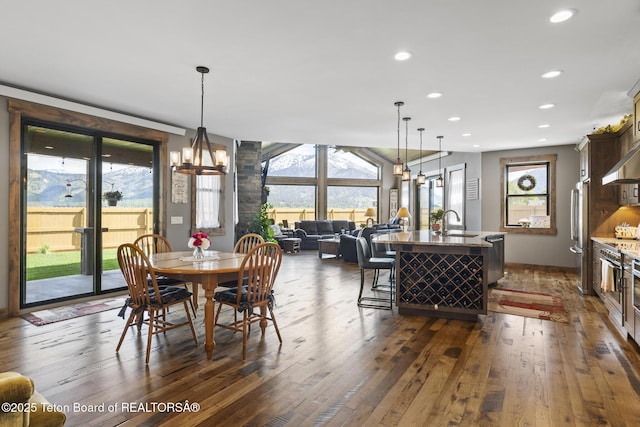 444 Riverview Dr, Alpine, WY 83128 - dining room featuring dark wood finished floors, recessed lighting, and a chandelier