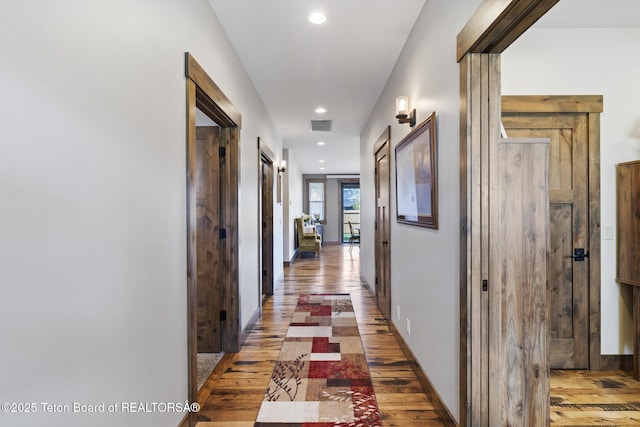 444 Riverview Dr, Alpine, WY 83128 - hallway with light wood-style flooring, recessed lighting, and baseboards
