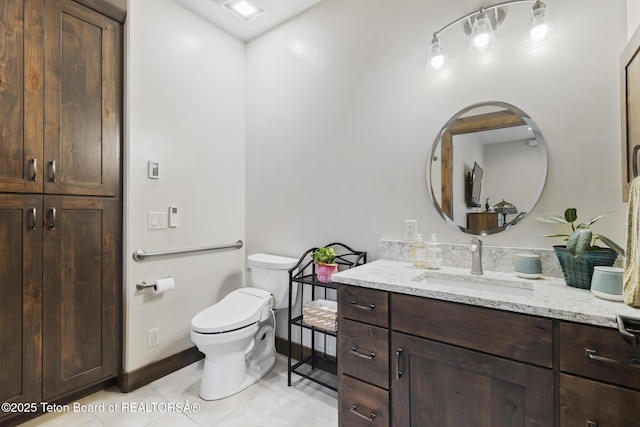 444 Riverview Dr, Alpine, WY 83128 - bathroom featuring vanity, tile patterned flooring, toilet, and baseboards