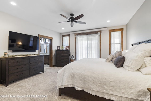444 Riverview Dr, Alpine, WY 83128 - bedroom with recessed lighting, light carpet, ceiling fan, and connected bathroom