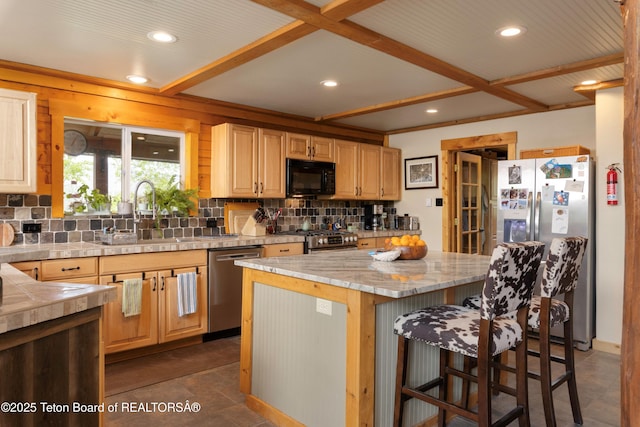 57 Lynx Trl, Alpine, WY 83128 - kitchen featuring stainless steel appliances, a sink, backsplash, a center island, and recessed lighting