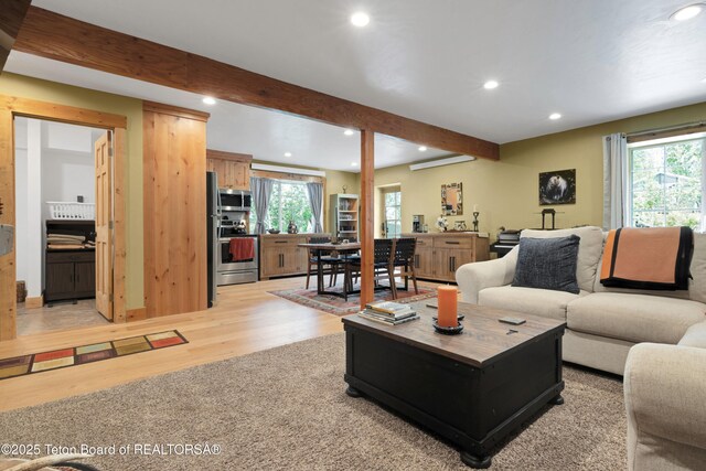 57 Lynx Trl, Alpine, WY 83128 - living room featuring recessed lighting, light wood-style flooring, healthy amount of natural light, and beamed ceiling