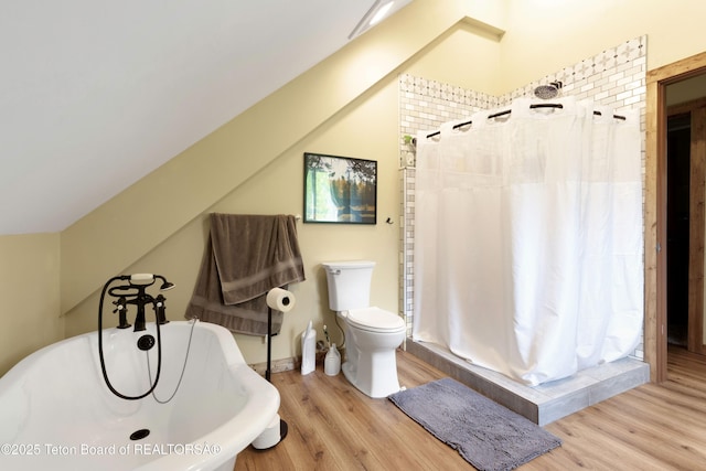 57 Lynx Trl, Alpine, WY 83128 - full bathroom featuring wood finished floors, a shower stall, toilet, and a soaking tub