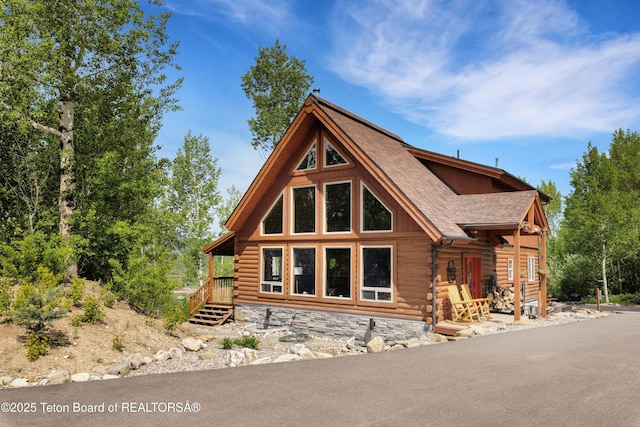 57 Lynx Trl, Alpine, WY 83128 - log home with a shingled roof and log siding