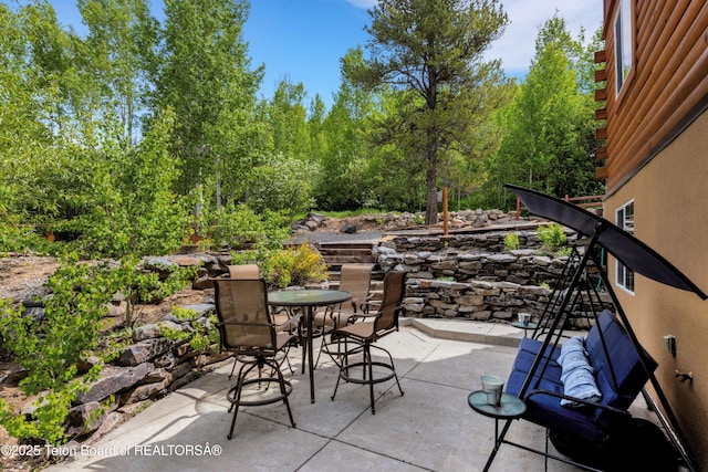 57 Lynx Trl, Alpine, WY 83128 - view of patio featuring outdoor dining area