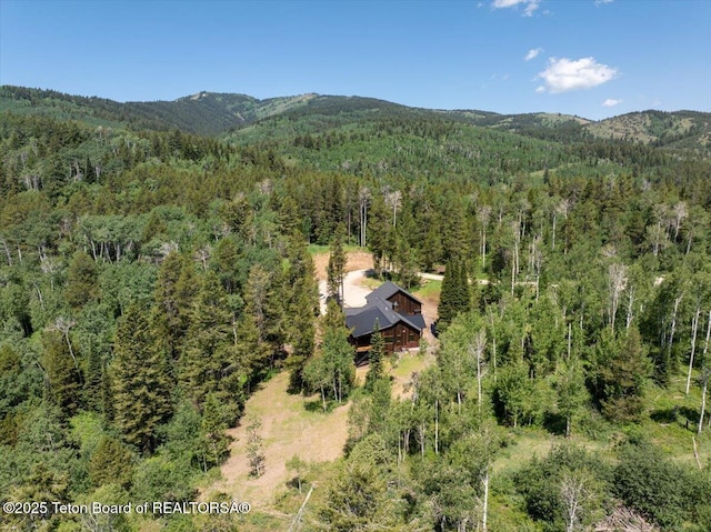 5727 Forest Ridge Rd, Victor, ID 83455 - bird's eye view of a heavily wooded area and a mountain backdrop