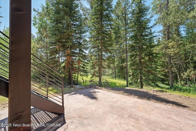 5727 Forest Ridge Rd, Victor, ID 83455 - view of patio featuring a wooded view