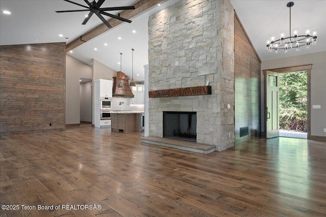 5727 Forest Ridge Rd, Victor, ID 83455 - unfurnished living room with high vaulted ceiling, ceiling fan, a chandelier, dark wood-style flooring, and beamed ceiling