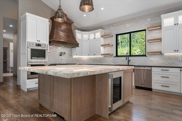 5727 Forest Ridge Rd, Victor, ID 83455 - kitchen featuring open shelves, wood counters, stainless steel appliances, wine cooler, and a center island