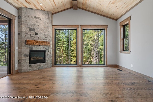 5727 Forest Ridge Rd, Victor, ID 83455 - unfurnished living room featuring wood finished floors, lofted ceiling, a stone fireplace, and wood ceiling