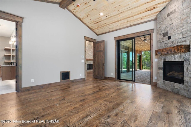 5727 Forest Ridge Rd, Victor, ID 83455 - unfurnished living room with a fireplace, wood finished floors, a wooden ceiling with exposed beams, and high vaulted ceiling