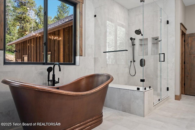 5727 Forest Ridge Rd, Victor, ID 83455 - bathroom featuring a freestanding bath, a stall shower, and plenty of natural light