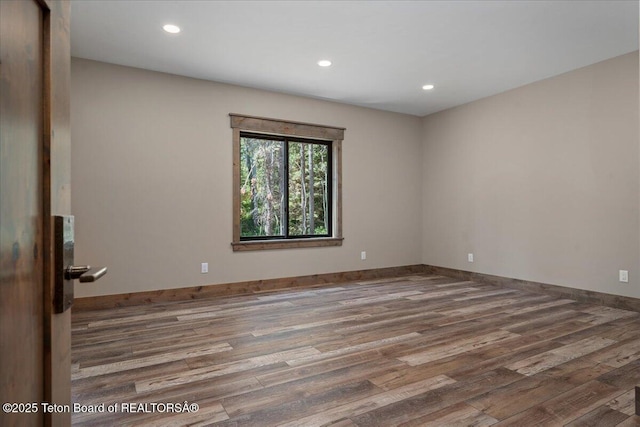 5727 Forest Ridge Rd, Victor, ID 83455 - unfurnished room with wood finished floors and recessed lighting