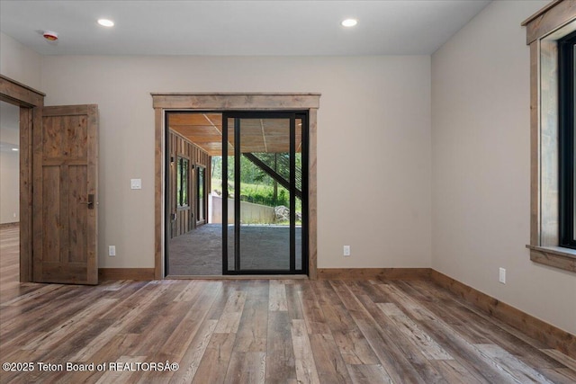 5727 Forest Ridge Rd, Victor, ID 83455 - empty room featuring wood finished floors and recessed lighting
