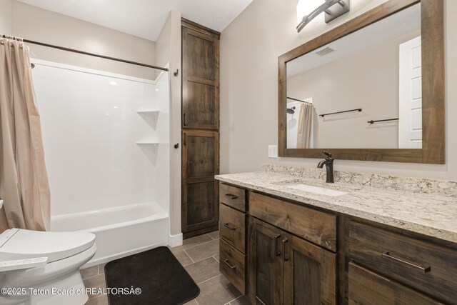 405 Vista Dr, Star Valley Ranch, WY 83127 - full bath with vanity, shower / bath combo with shower curtain, toilet, and tile patterned floors
