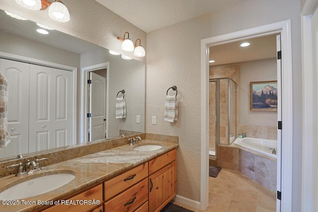 165 Cobble Creek Ln, Driggs, ID 83422 - bathroom featuring a garden tub, a stall shower, double vanity, recessed lighting, and tile patterned flooring