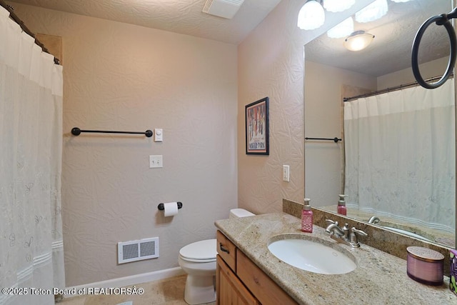 165 Cobble Creek Ln, Driggs, ID 83422 - bathroom featuring toilet, vanity, and baseboards