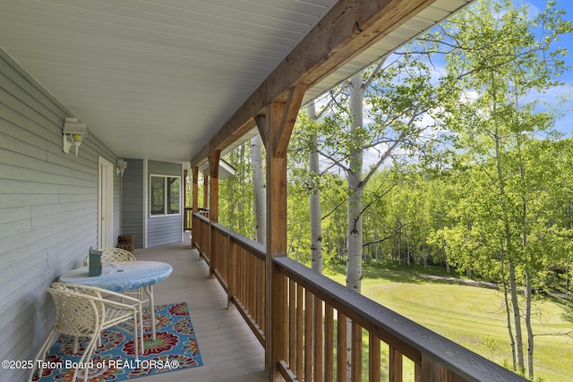 279 Vista E Dr, Star Valley Ranch, WY 83127 - wooden deck featuring a lawn and view of wooded area