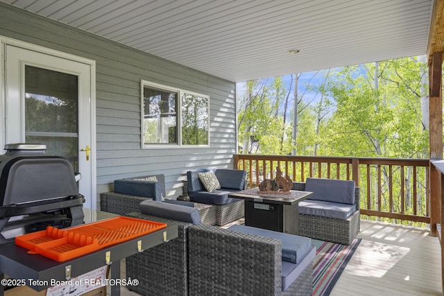 279 Vista E Dr, Star Valley Ranch, WY 83127 - wooden deck featuring an outdoor living space with a fire pit