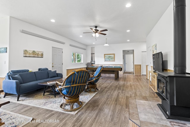 279 Vista E Dr, Star Valley Ranch, WY 83127 - living area featuring a wood stove, light wood-style floors, billiards, a ceiling fan, and recessed lighting