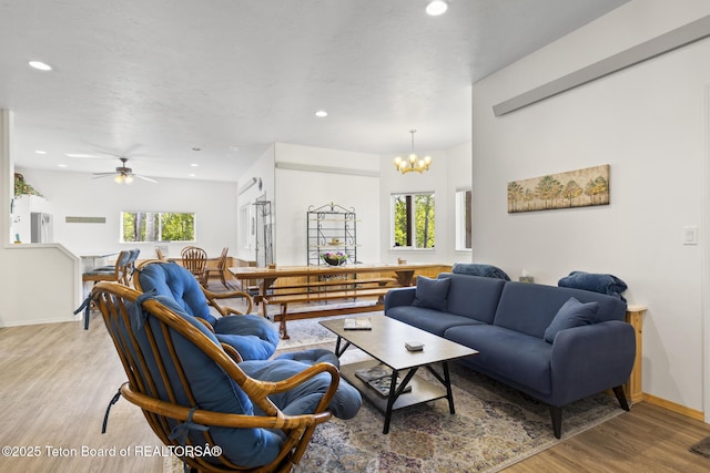279 Vista E Dr, Star Valley Ranch, WY 83127 - living room featuring light wood-style floors, a chandelier, baseboards, recessed lighting, and ceiling fan