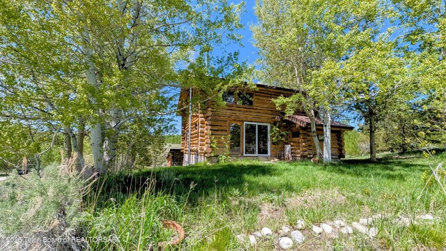 10559 Rammell Mountain Rd, Tetonia, ID 83452 - view of front of house with log siding