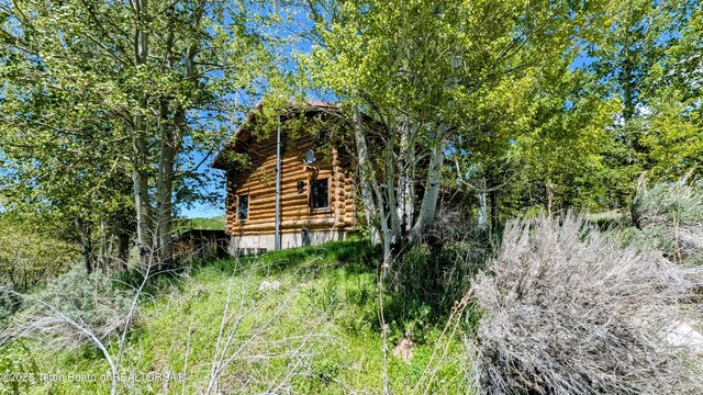 10559 Rammell Mountain Rd, Tetonia, ID 83452 - view of home's exterior with log siding