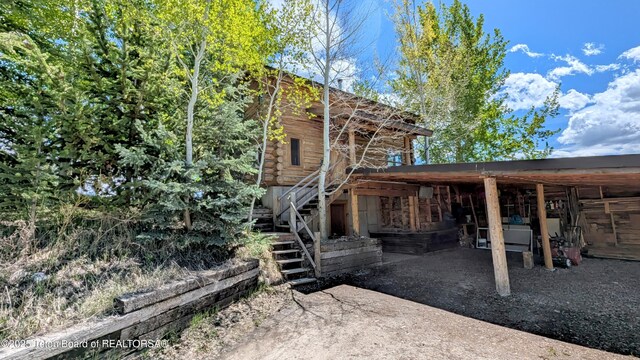 10559 Rammell Mountain Rd, Tetonia, ID 83452 - exterior space featuring stairway and log exterior