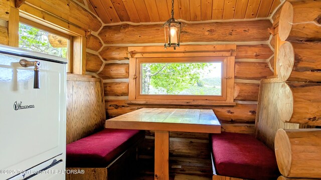 10559 Rammell Mountain Rd, Tetonia, ID 83452 - dining area with rustic walls, healthy amount of natural light, and wood ceiling