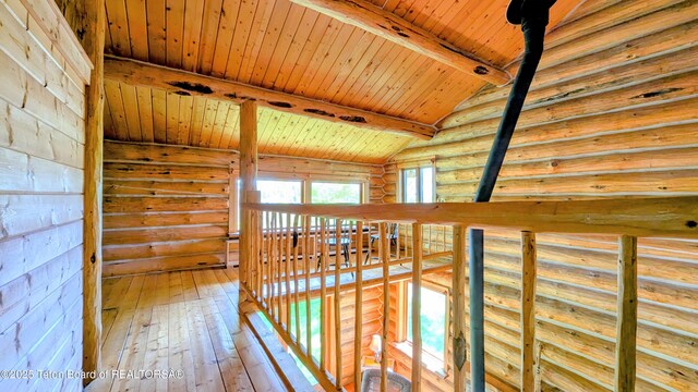 10559 Rammell Mountain Rd, Tetonia, ID 83452 - corridor with rustic walls, wood ceiling, and wood-type flooring