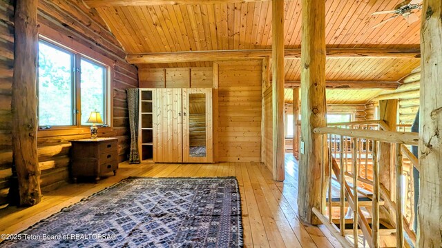 10559 Rammell Mountain Rd, Tetonia, ID 83452 - hall with light wood-style flooring, wood ceiling, and rustic walls