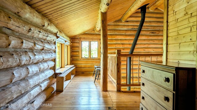 10559 Rammell Mountain Rd, Tetonia, ID 83452 - hallway featuring wood ceiling, rustic walls, and light wood finished floors