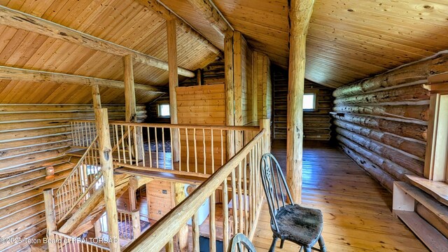 10559 Rammell Mountain Rd, Tetonia, ID 83452 - hall featuring log walls, wood ceiling, hardwood / wood-style flooring, and an upstairs landing