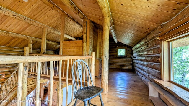 10559 Rammell Mountain Rd, Tetonia, ID 83452 - hallway with rustic walls, plenty of natural light, wood-type flooring, and wooden ceiling