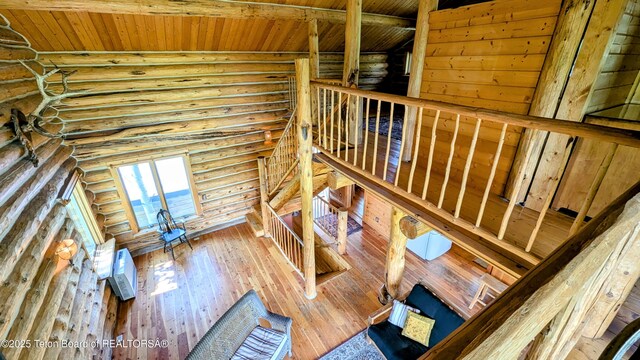 10559 Rammell Mountain Rd, Tetonia, ID 83452 - staircase featuring rustic walls, wood-type flooring, and wood ceiling