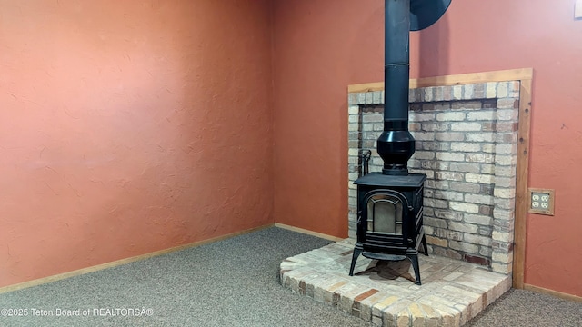 10559 Rammell Mountain Rd, Tetonia, ID 83452 - detailed view of a wood stove, carpet, and baseboards