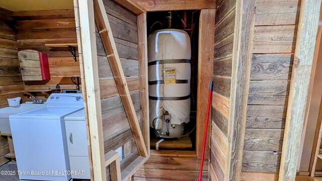 10559 Rammell Mountain Rd, Tetonia, ID 83452 - laundry area with wood walls and independent washer and dryer