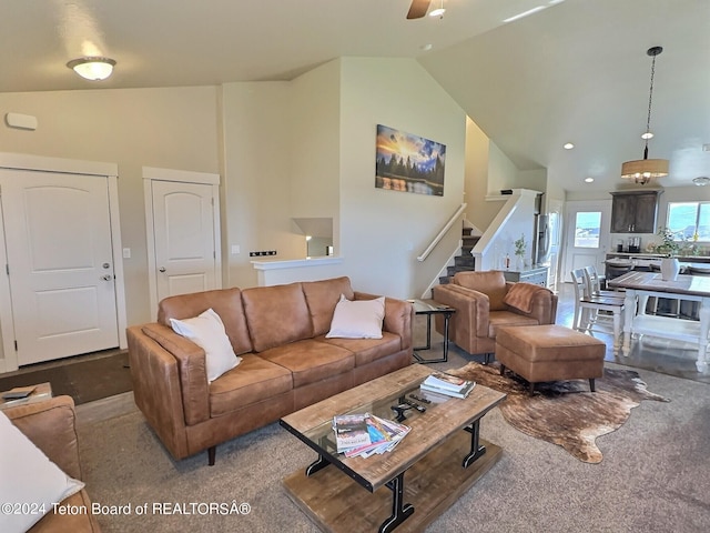 2929 Iron Wood Dr, Driggs, ID 83422 - living room with stairs, carpet flooring, ceiling fan, and high vaulted ceiling
