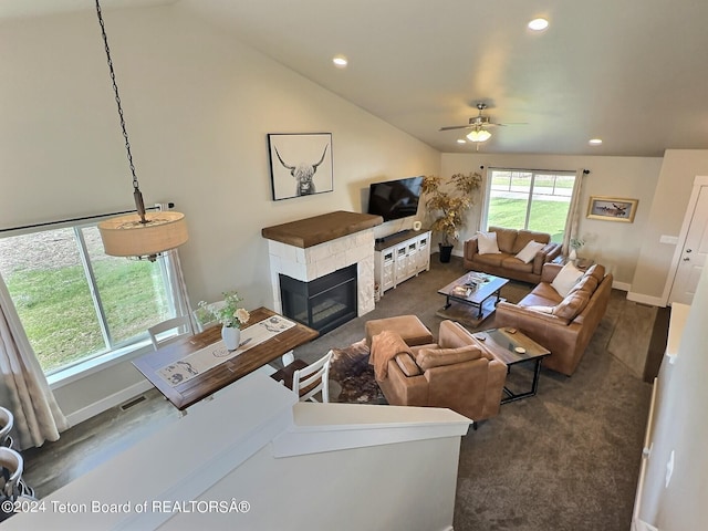 2929 Iron Wood Dr, Driggs, ID 83422 - carpeted living room featuring ceiling fan, a glass covered fireplace, vaulted ceiling, recessed lighting, and baseboards