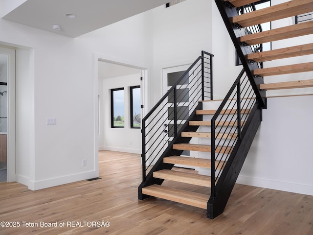 155 Sagewood Dr, Driggs, ID 83422 - stairway with baseboards and wood finished floors