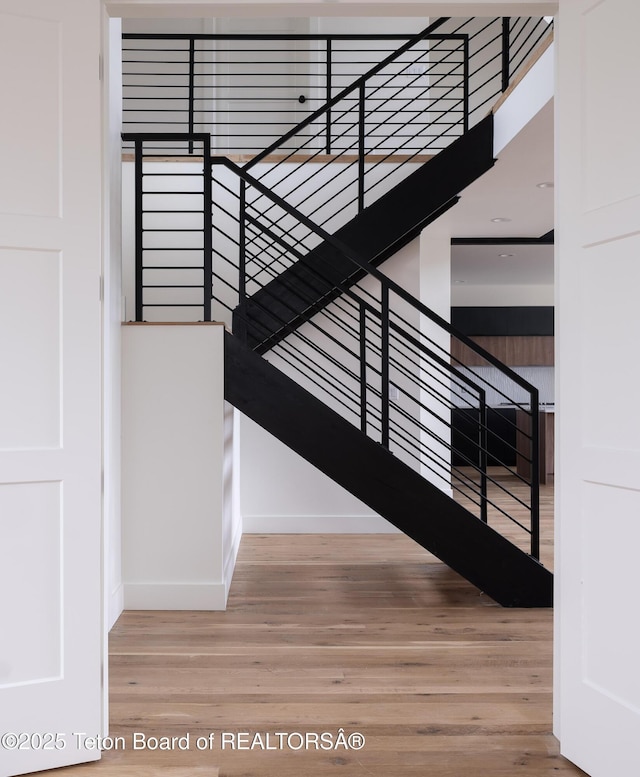 155 Sagewood Dr, Driggs, ID 83422 - stairway with baseboards and wood finished floors