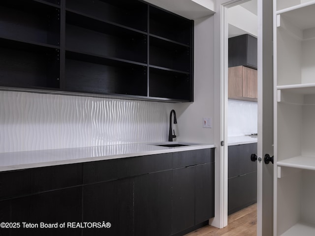 155 Sagewood Dr, Driggs, ID 83422 - bar area featuring a sink and light wood-style floors