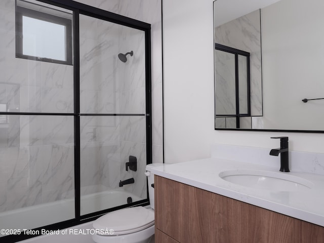 155 Sagewood Dr, Driggs, ID 83422 - bathroom featuring toilet, vanity, and shower / bath combination with glass door