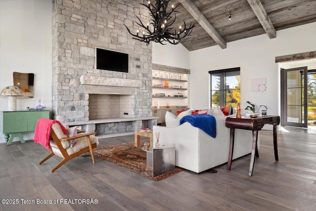 900 Mountain Bluebird Ct, Driggs, ID 83422 - living area with wood finished floors, a stone fireplace, high vaulted ceiling, a chandelier, and wood ceiling with exposed beams