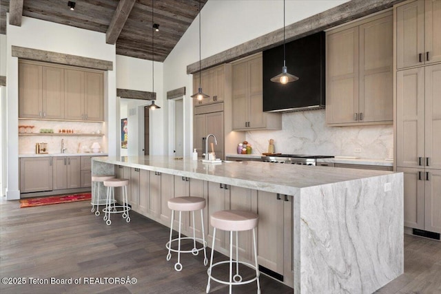 900 Mountain Bluebird Ct, Driggs, ID 83422 - kitchen featuring dark wood finished floors, tasteful backsplash, wooden ceiling, a large island, and wall chimney exhaust hood