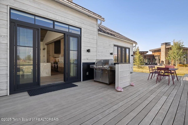 900 Mountain Bluebird Ct, Driggs, ID 83422 - deck with outdoor dining space and area for grilling