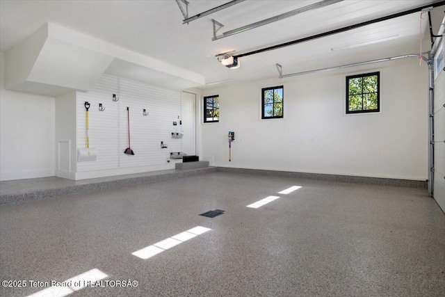 900 Mountain Bluebird Ct, Driggs, ID 83422 - garage with baseboards and a garage door opener
