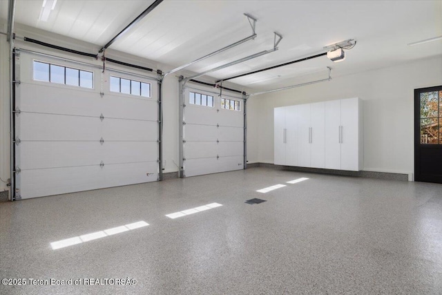 900 Mountain Bluebird Ct, Driggs, ID 83422 - garage featuring a garage door opener