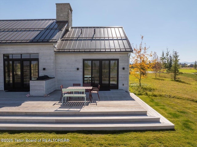 900 Mountain Bluebird Ct, Driggs, ID 83422 - back of house with a standing seam roof, a chimney, and metal roof