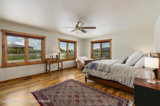 500 E Solitude Dr, Jackson, WY 83001 - bedroom with wood finished floors, baseboards, and ceiling fan